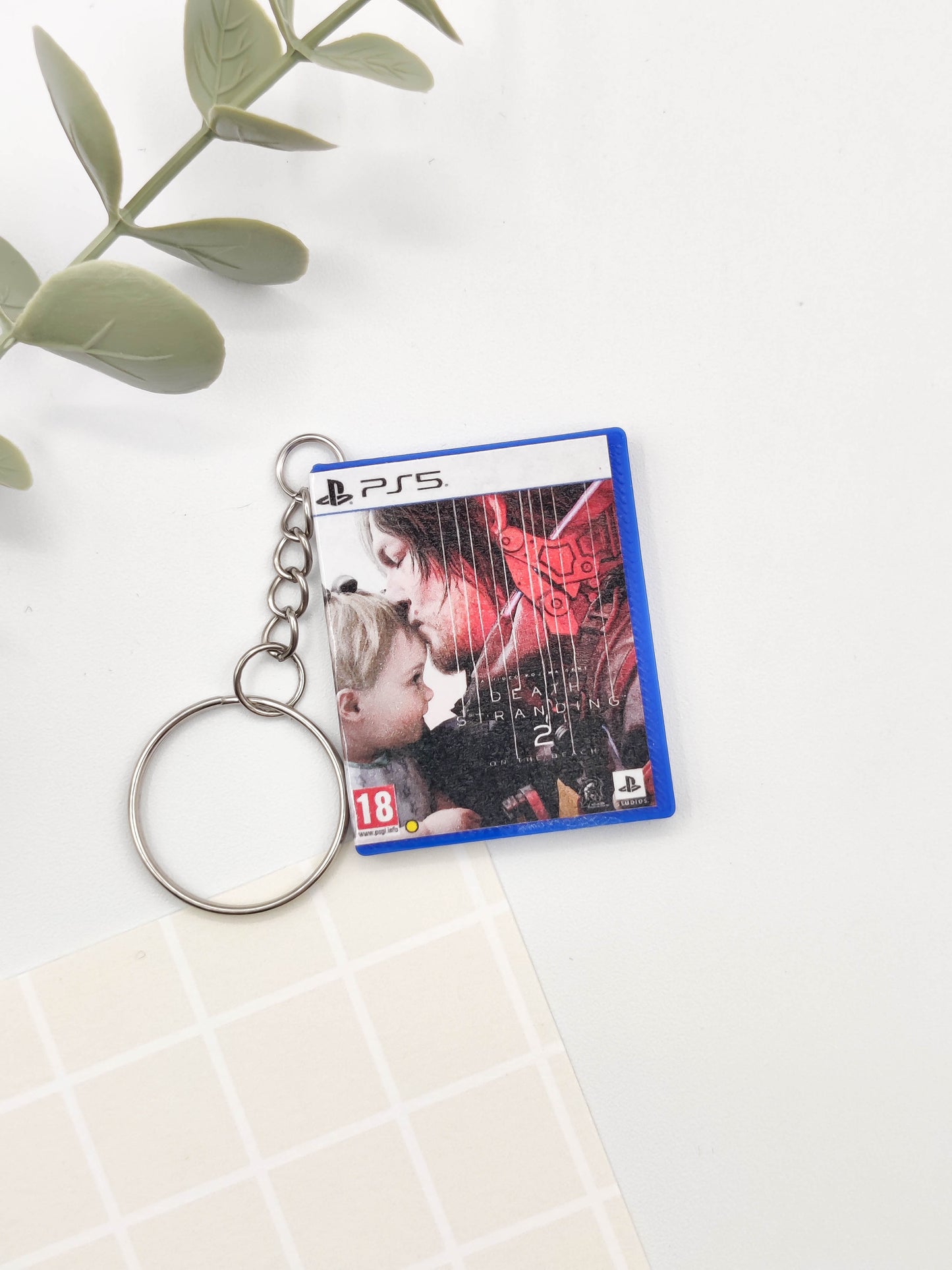 Llavero caja juego PS5 - Death Stranding 2